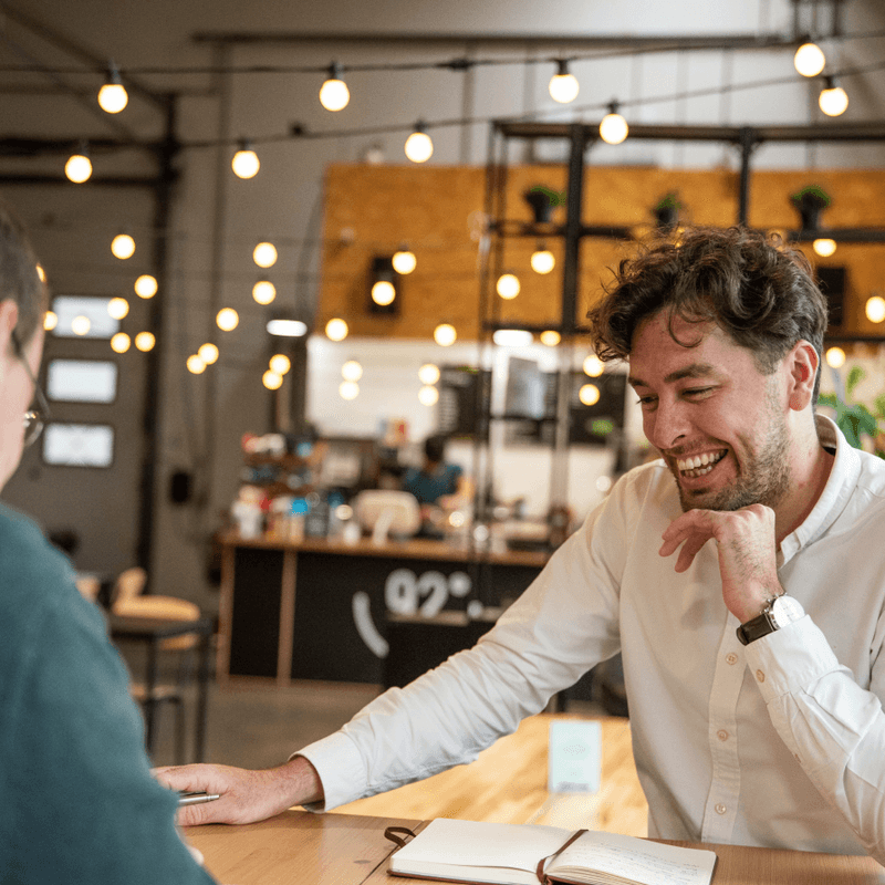 man smiling while thinking